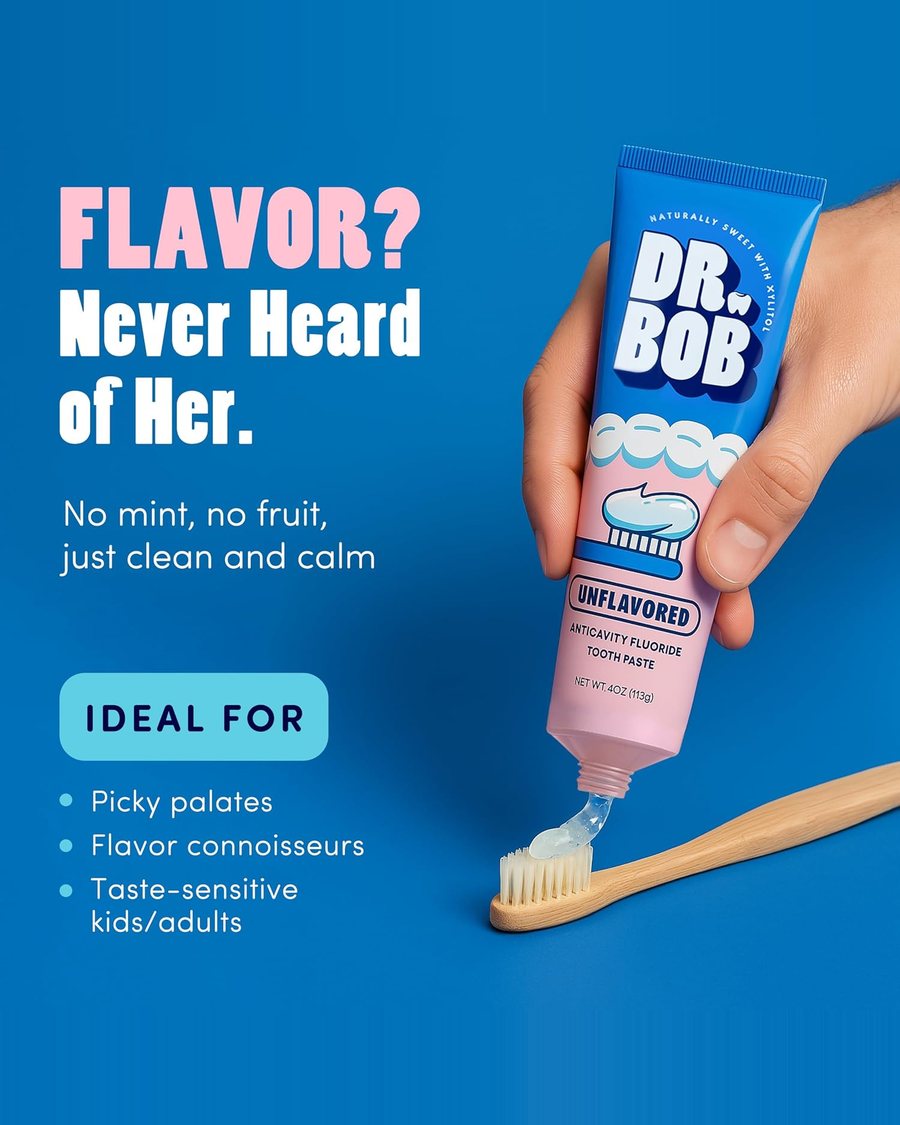 Flavor? Never heard of her. A hand squeezing Dr. Bob unflavored gel onto a bamboo toothbrush